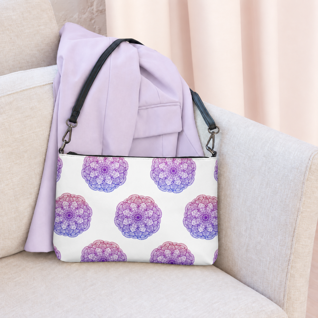 Lavender Mandala Crossbody Bag on a cream armchair with a lavender jacket