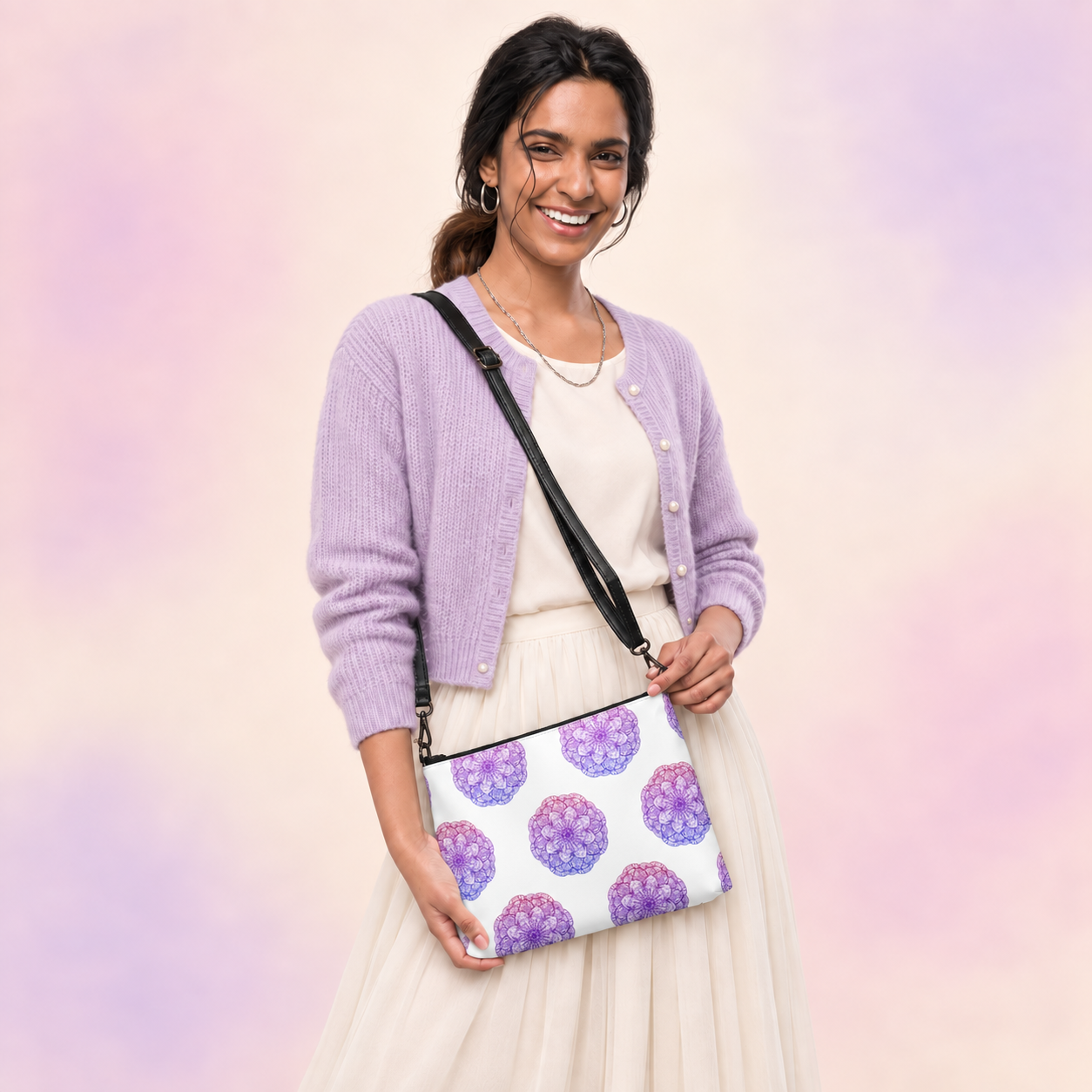 Purple mandala crossbody bag worn with a lavender cardigan and cream skirt